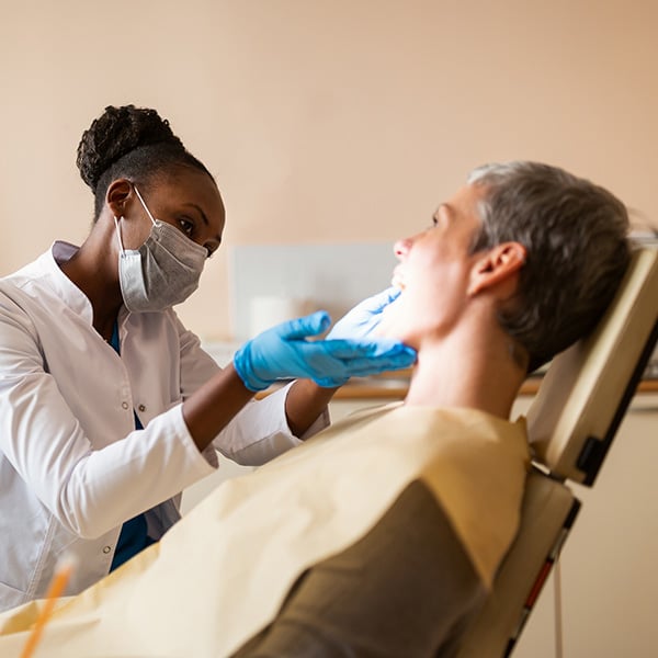 dentist looking in the patients mouth