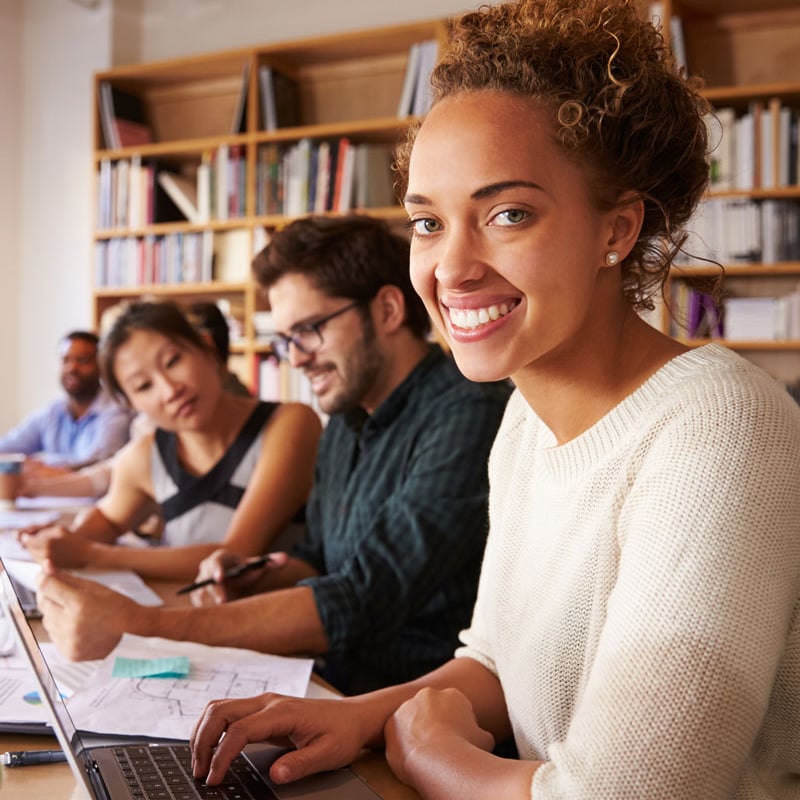 lady smiling in a library